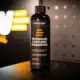 CARGLOW Premium Ceramic Shampoo rechtop met oranje CARGLOW-logo op de achtergrond
